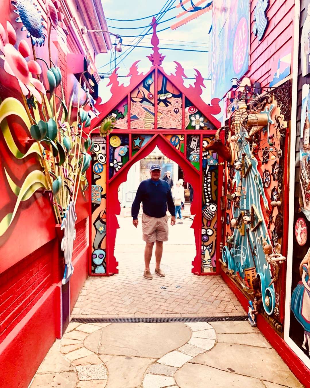 Cos standing in colorful doorway/arch